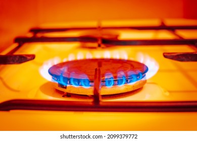 flaming gas in a residential stove, close-ups, strongly warm colors, household energy price concept, fiery color  - Shutterstock ID 2099379772