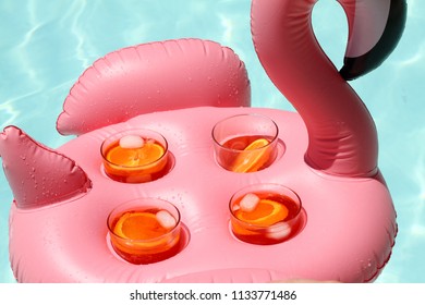 Flamingo Drink Holder With Aperol Spritz In A Pool Party