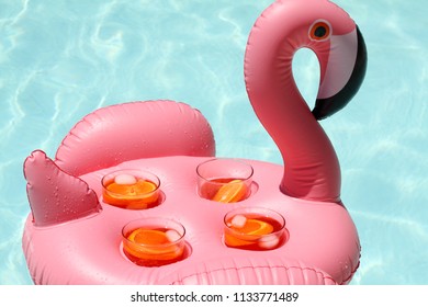 Flamingo Drink Holder With Aperol Spritz In A Pool Party