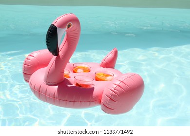 Flamingo Drink Holder With Aperol Spritz In A Pool Party