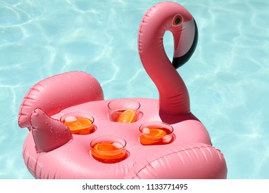 Flamingo Drink Holder With Aperol Spritz In A Pool Party