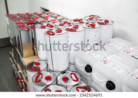 Flammable liquid in a metal canister in a storage room, research concept, handling of dangerous substances