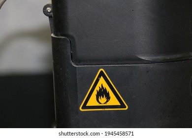 Flammable substance label affixed to the machine with ethyl alcohol. selective focus