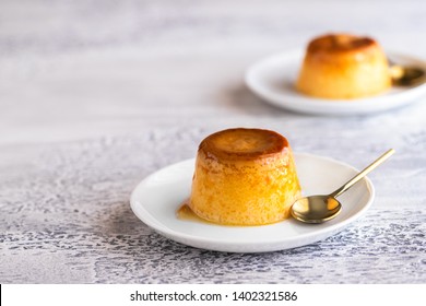 Flan Dessert On The Plate. Popular Crème Caramel Dessert Background With Copy Space.

