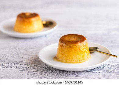 Flan Dessert On The Plate .Popular Crème Caramel Dessert Background With Copy Space.

