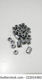 Flange Nuts On White Work Table