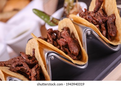 Flank steak tacos with roasted chili peppers and onions "tacos de arrachera con chiles toreados"