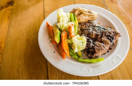 Flank Steak With Vegetables And Baked Potato