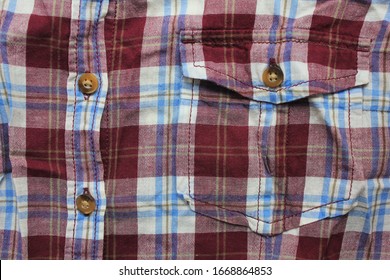 Flannel Colorful Shirt With Front Pocket And Buttons. Casual Plaid Lumberjack Shirt Detail, Purple & White Color Clothes Close Up Top View