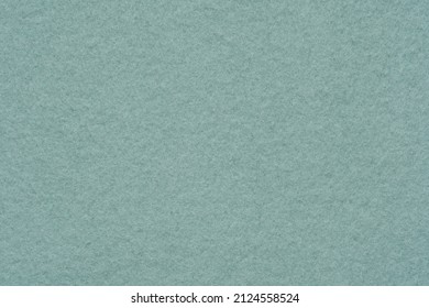A flannelette. The backside of a knitted fabric with fleece. A napped cotton jersey fabric, light green flannel cloth.