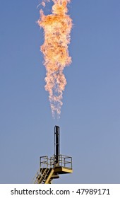 Flare burning natural gas to the atmosphere on an oil production platform