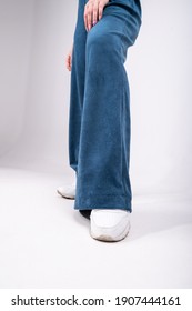 Flared Trousers, Blue, Worn On A Girl, Close-up. High Quality Photo