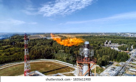 Flaring of associated gas at a petrochemical plant. Aerial view.