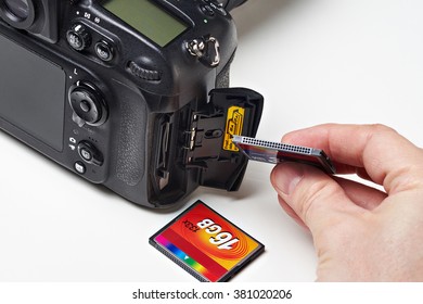 Flash card CF and DSLR camera close-up