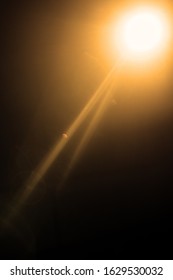 Flash of a distant abstract star. Abstract sun flare. The lens flare is subject to digital correction. - Image toned