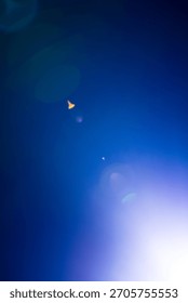 Flash of a distant abstract star. Abstract sun flare. The lens flare is subject to digital correction. - Image
