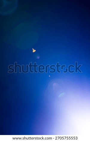 Flash of a distant abstract star. Abstract sun flare. The lens flare is subject to digital correction. - Image