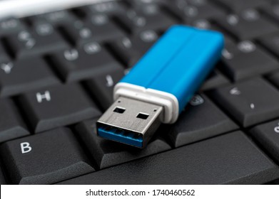 Flash drive on the laptop keyboard. 