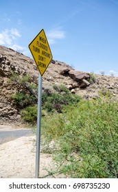 Flash Flood Road Sign Warns To Turn Around, Don't Drown In Case Of A Flash Flood In The Desert.