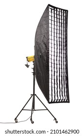 Flash Light With Strip Softbox And Grid On Stand With Wheels. Studio Lighting Equipment Isolated On White Background.