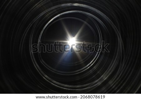 Flash of light through rings