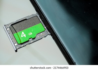 Flash memory data storage concept : A tray with a micro SD. A memory card is used for storing digital information in portable electronic devices e.g mobile phone, tablets etc