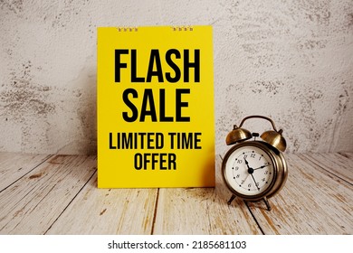 Flash Sale Text Message And Alarm Clock On Wooden Background