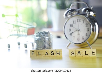 Flash Sale Word Written With Wooden Letters And Coin,alarm Clock,mini Shopping Cart.shopping Online Concept.