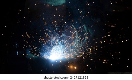 Flash with sparks from a welding arc - Powered by Shutterstock