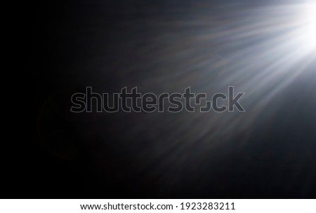 Flash or Star Light Rays over Black Background. Also can be used as an Overlay with a Blending Mode (screen).