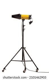 Flash strobe with snoot light modificator on stand with wheels. Studio lighting equipment isolated on white background.