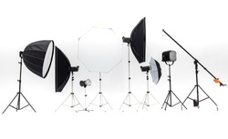 Flash studios of various sizes and accessories are placed together on a white background., a Technology Photo by Bangkok Click Studio