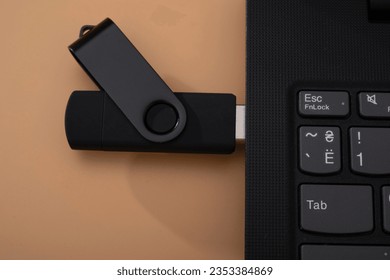 flashcard and laptop. data transmission. solid state drive.