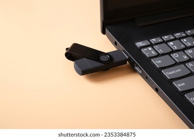 flashcard and laptop. data transmission. solid state drive.
