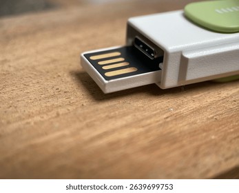 A flashdisk with a blury background and the wood 