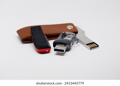 Flashdisk is an external data storage device connected to a USB port that can store various data formats with a white background color.