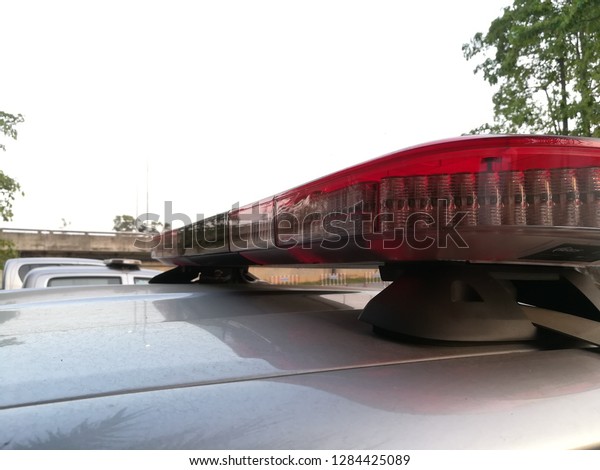 The flashing\
lights on the police car\
roof.