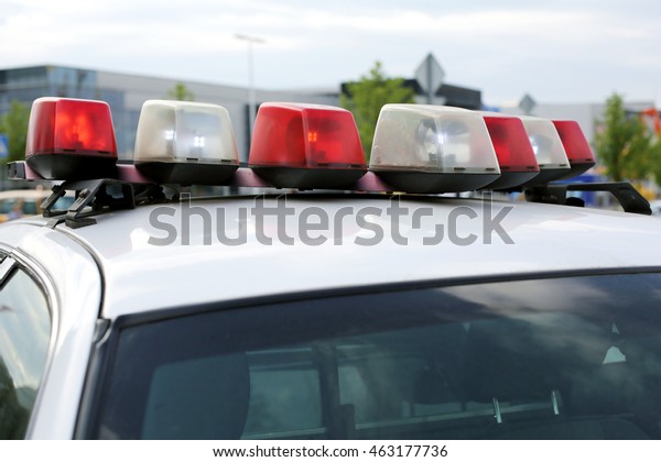 Flashing lights of a police\
car