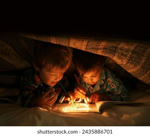 Flashlight, blanket and children at night with happiness in dark with drawing in a book. Friends, relax and sketch on notebook with torch or light under duvet at sleepover with a pillow tent - Powered by Shutterstock