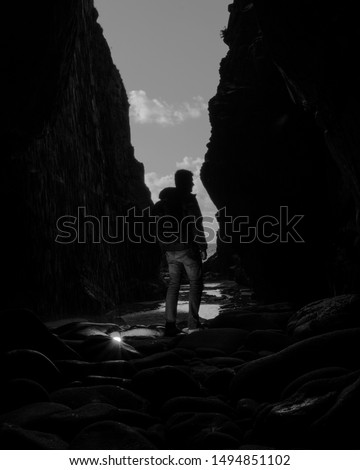 Flashlit cave at Plémont Bay in Jersey Channel Islands