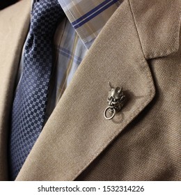 A Flashy Lapel Pin On A Man's Nice Suit.