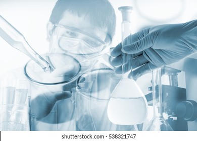 Flask In Scientist Hand With Dropping Chemical Liquid To Test Tubes, Science And Medical Research And Development Concept