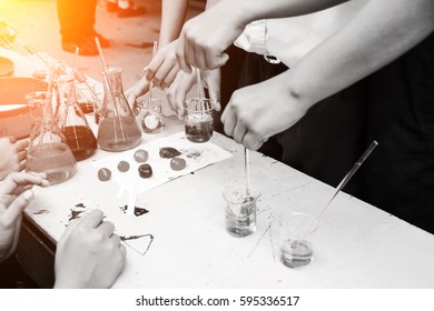 Flask In Student Hand With Test Tube. Learning The Science Of Elementary School Students.