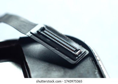 Flat connector with a loop in the phone close-up on a white background.