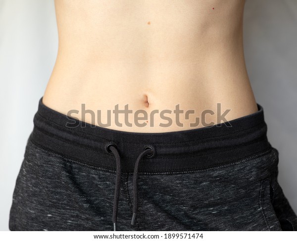 Flat Female Belly Woman Showing Her Stock Photo 1899571474 | Shutterstock