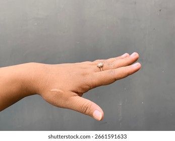 Flat hand with palm down facing left, simple horizontal gesture.