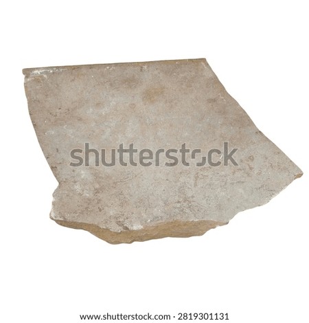 Flat irregular shaped piece of light grey sandstone paving rock isolated on a white background natural material texture