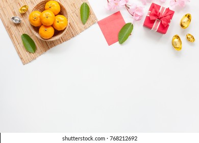 Flat lay of accessories Chinese new year and decorations Lunar new year festival concept background.Difference items on modern white wooden at office.Other language mean rich or wealthy and happy.