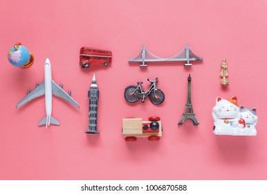 Flat lay aerial image of travel background concept.Table top view of souvenir symbol location or landmark of place for traveler all the world.objects on modern rustic pink paper.mock up & template.