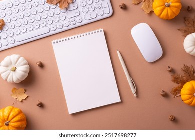 Flat lay of an autumn themed workspace featuring a keyboard, mouse, notepad, pen, and mini pumpkins to evoke creativity and seasonal warmth - Powered by Shutterstock